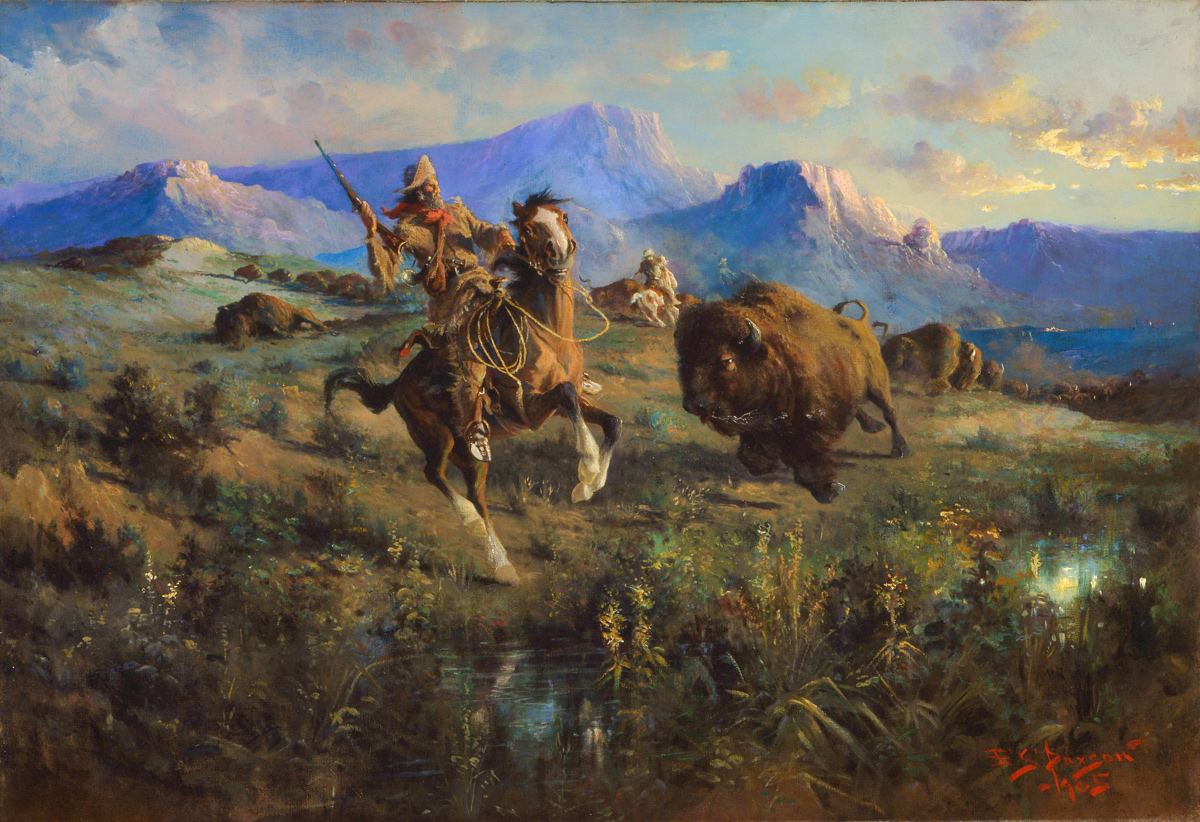 A bison running towards the hunter and his horse