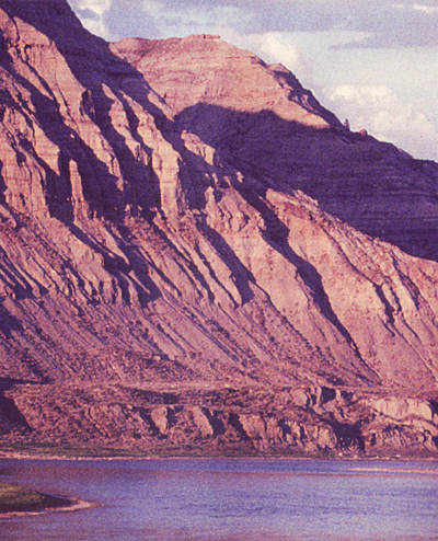 Bare and steep cliffs with rocks tumbling into the Missouri River