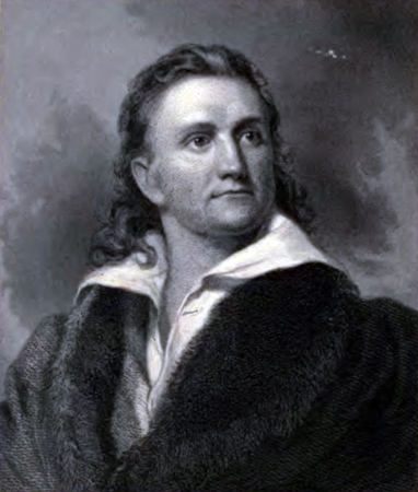 A young man with long hair and penetrating gaze