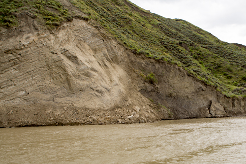 Steep, brown bank with loose rocks