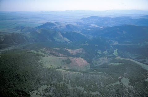 Aerial view of high foothills and plains around Lewis and Clark Pass