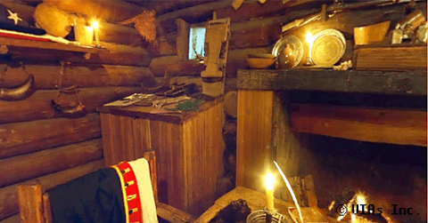 A candle-lit log room