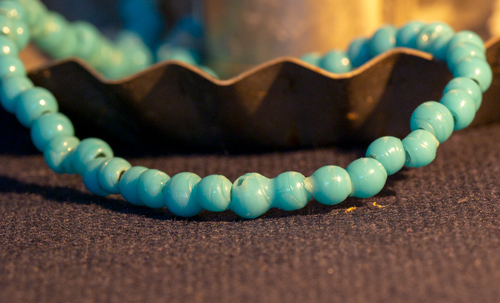 irregular blue beads in a necklace