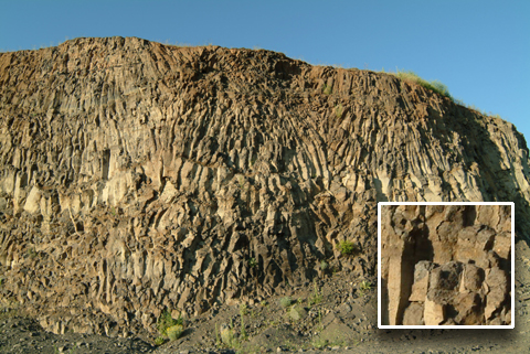Brown and gray rock in wavy columns