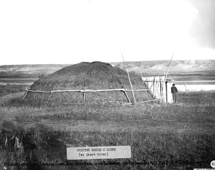 historic photo of an earthen lodge