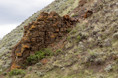Wall made from 'stacked' dark rock