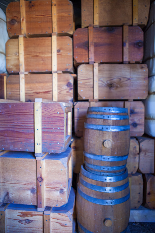Stacks of wood boxes and kegs