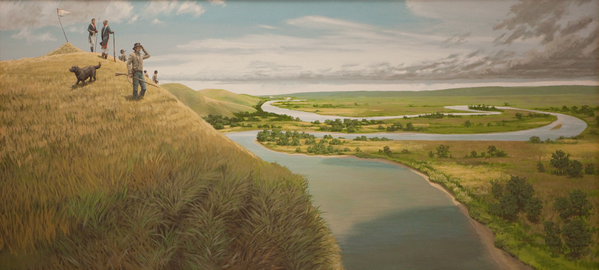Five men and a large dog atop a hill above the Missouri River