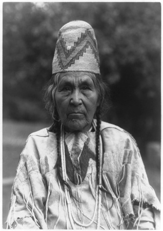 Old Indian woman wearing a 'basket' hat