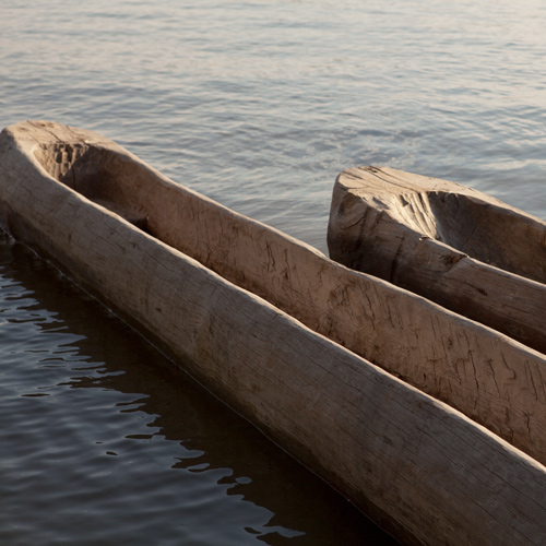 Two small dugout canoes in the water