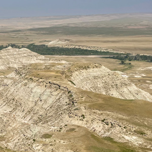 Expansive badland view of the Two Medicine River from a high bluff