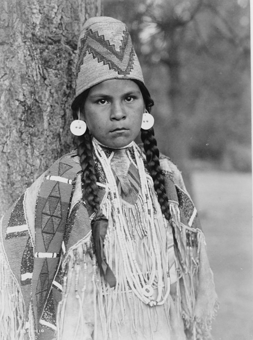 Young Indian girl with beaded finery