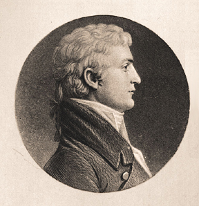 Lewis posing in profile showing his pony tail