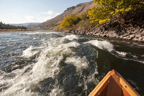 large waves in a rapid on a fall day