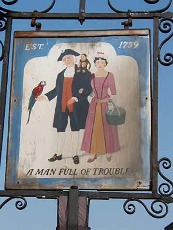 Colonial tavern sign featuring a man walking his lady, parrot, and two monkeys