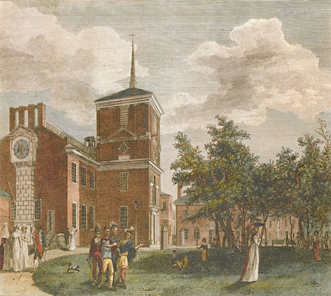 Large courtyard with people lounging in a park-like settings