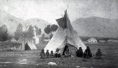 indian family before a tepee