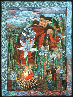 Blue quilt showing the camas bulb growing underground and the plant growing above ground