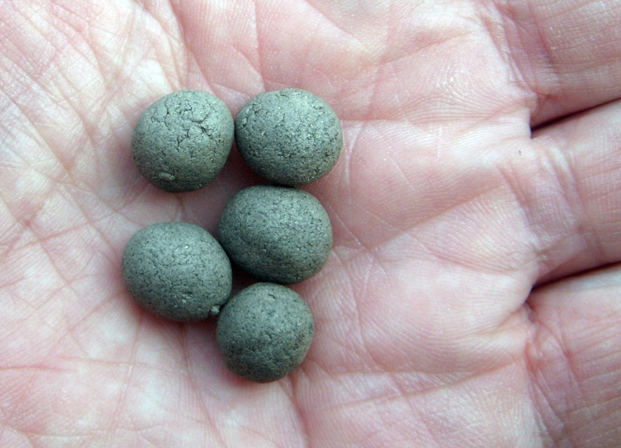 Blue-green handmade pills
