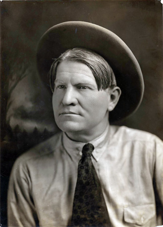 Photograph of Charles M. Russell in cowboy hat and tie