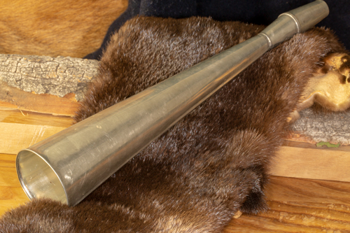A small round horn made from tin