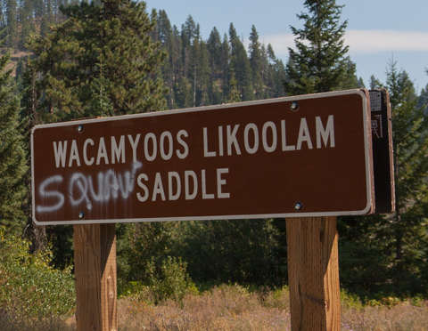 The word 'squaw' spray painted on the Wacamyoos Likoolam sign.