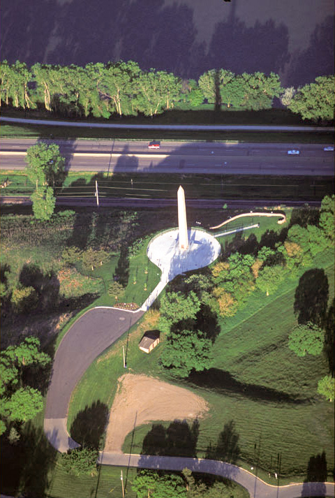 Floyd's monument from the air is a striking white obelisk
