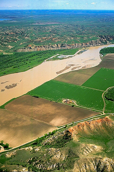 Aerial view of an oil well on the muddy Missouri River
