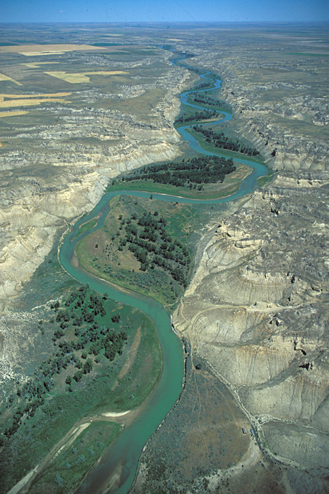 Small river winding through barren hills