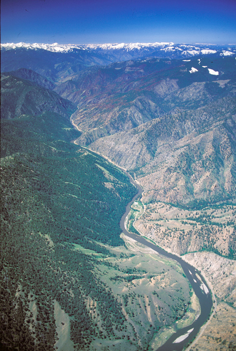 aerial view of a river winding through canyons