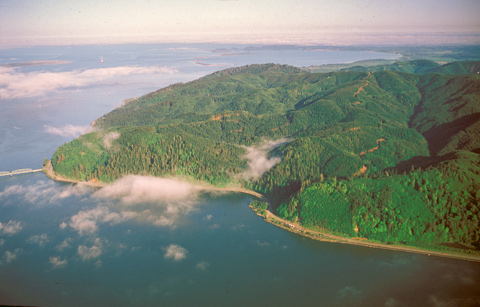 aerial view of a large prominatory jutting into a large river