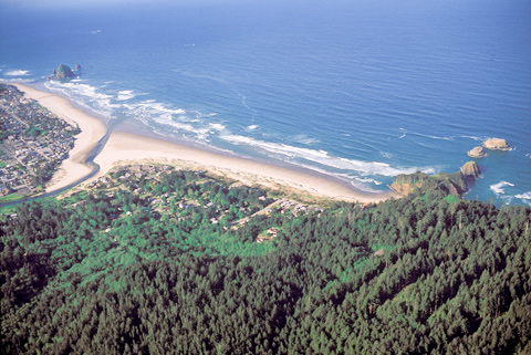 Aerial photo of Cannon Beach, a small beach on the Pacific Ocean