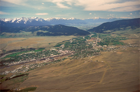 City on the plains before the snow-capped mountains