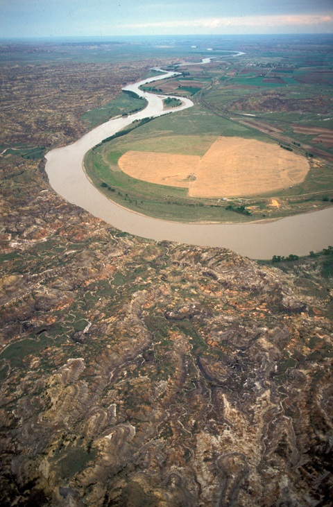 Aerial photo of the Yellowstone River meandering through barren country