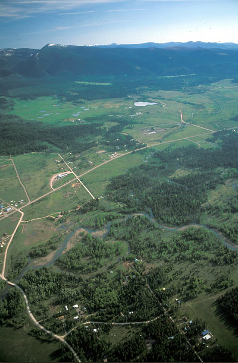 Interactive aerial photo of the Blackfoot river winding through a mountain valley