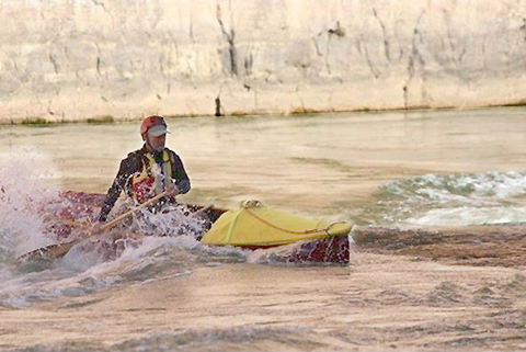 A modern canoeist in a rapid