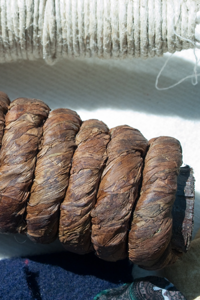 Brown leaves tightly woven to make a rope