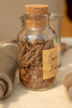 Small bottle with smooth bark pieces