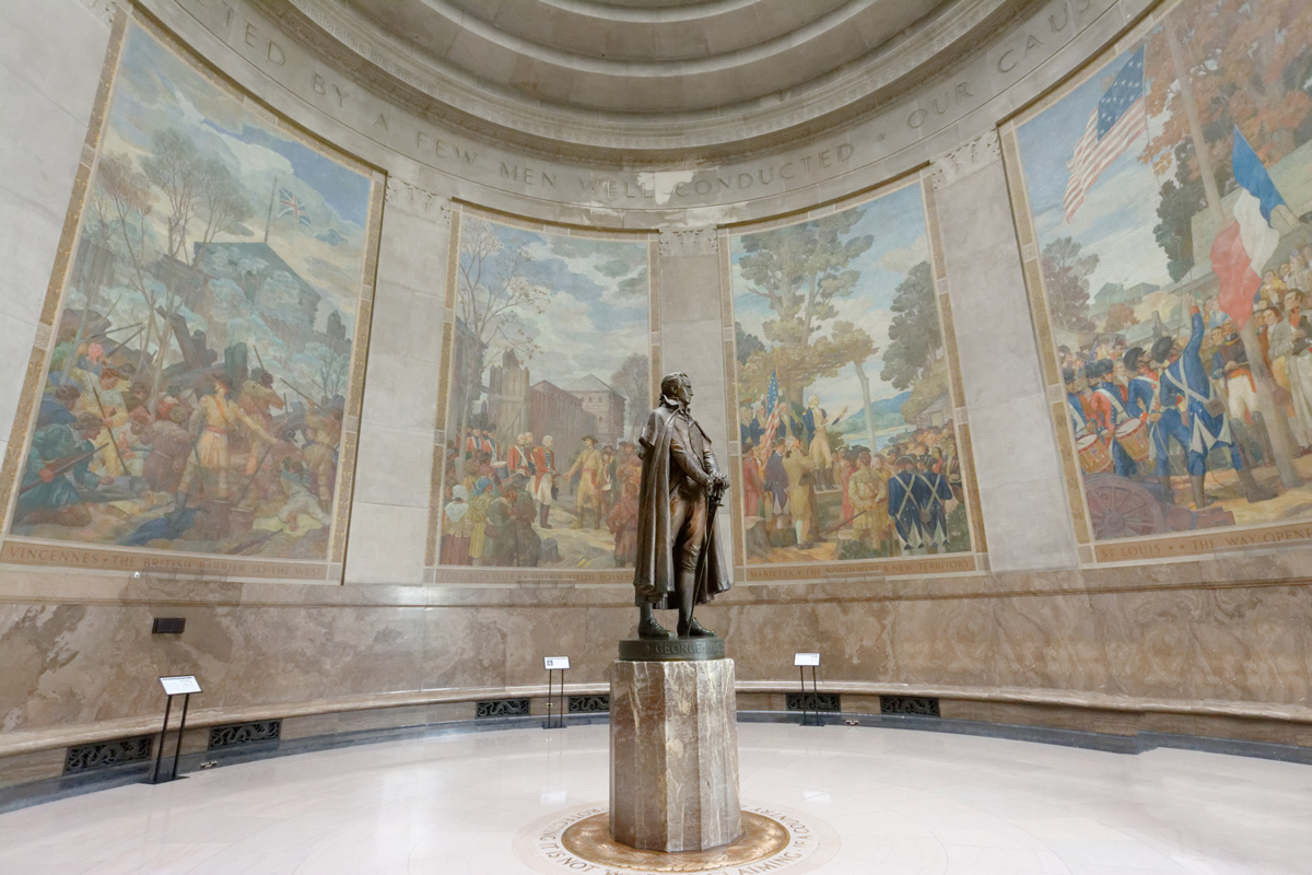 Larger than life murals surround a heroic statue of George Rogers Clark