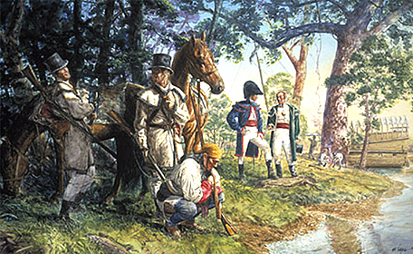 Drouillard looks closely at tracks in the river bank as the other men watch
