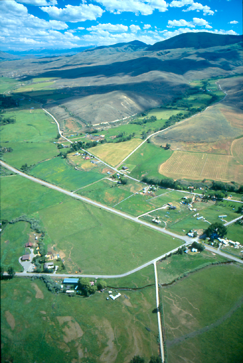 Small valley surrounded by brown hills