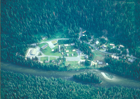 Aerial view of a mountain river and Forest Service complex
