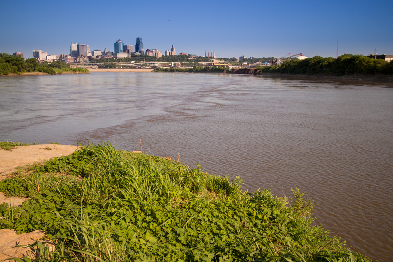 Two rivers join in front of the Kansas City skyline