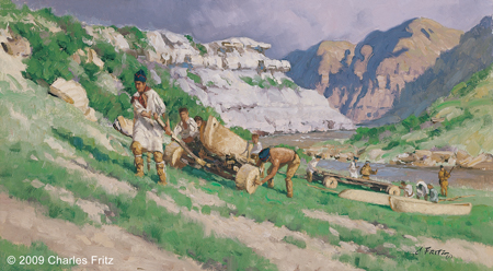 some men carry bundles and others push a canoe on cart up a steep hill