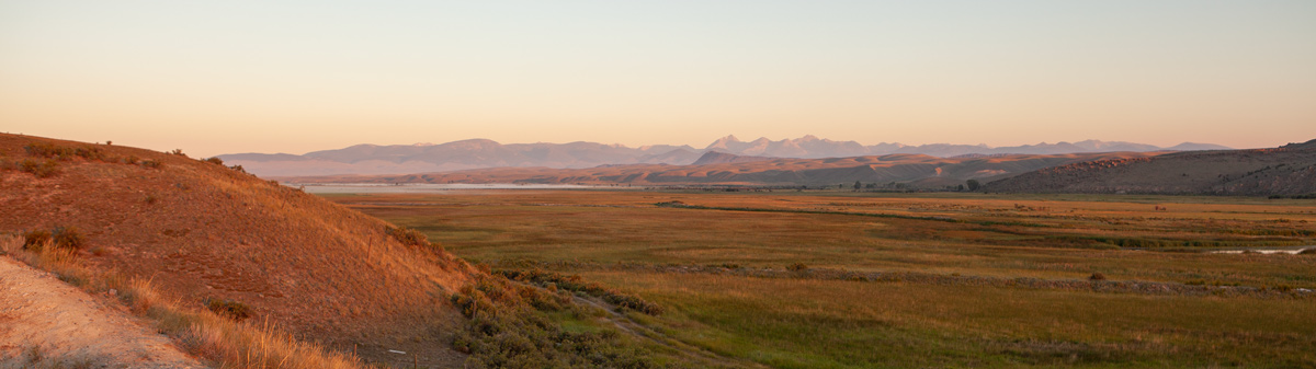 Golden light on a small river in a wide valley