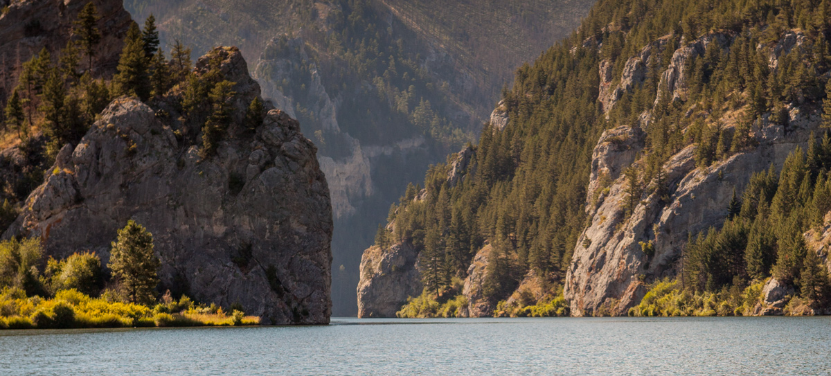 Cliffs rising above a blue river