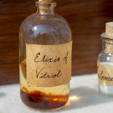 Small bottle of reddish medicine