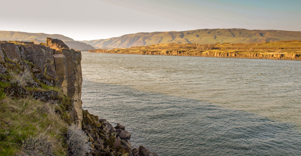basalt columns rise straight up from the river