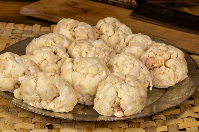 Raw, lumpy suet dumpling dough rolled into balls